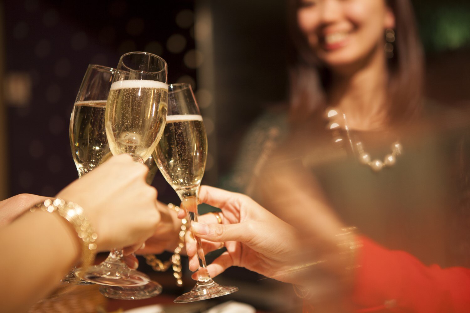 a group of people is celebrating festival with glasses