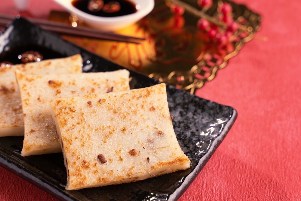 Golden brown turnip cakes, which is a traditional Cantonese dim sum dish